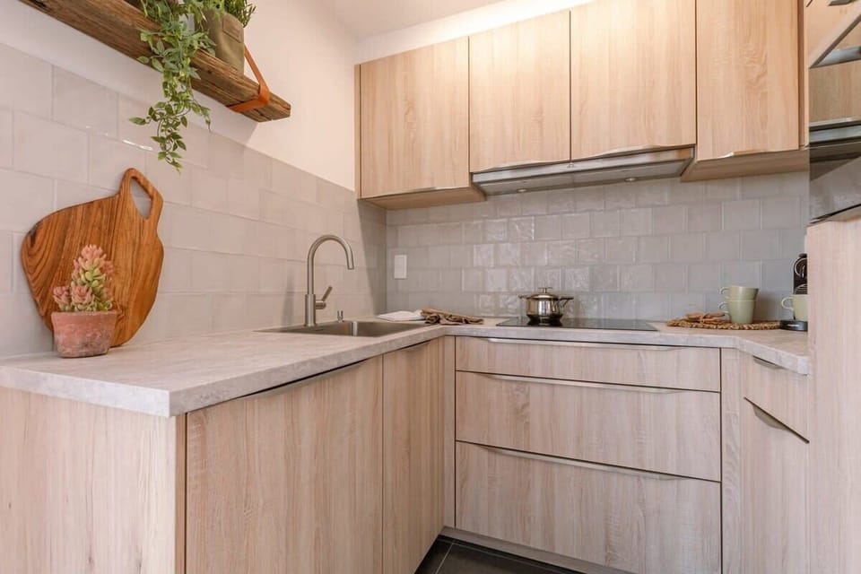 Kitchen designed with clean lines, quality materials, and a serene atmosphere.
