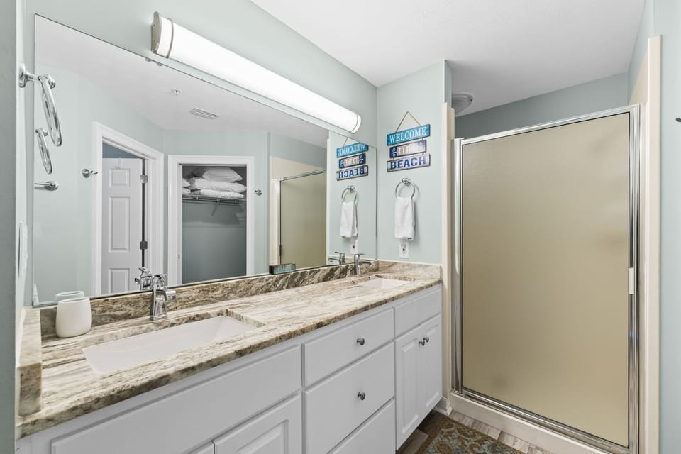Modern bathroom with granite countertop and walk-in shower