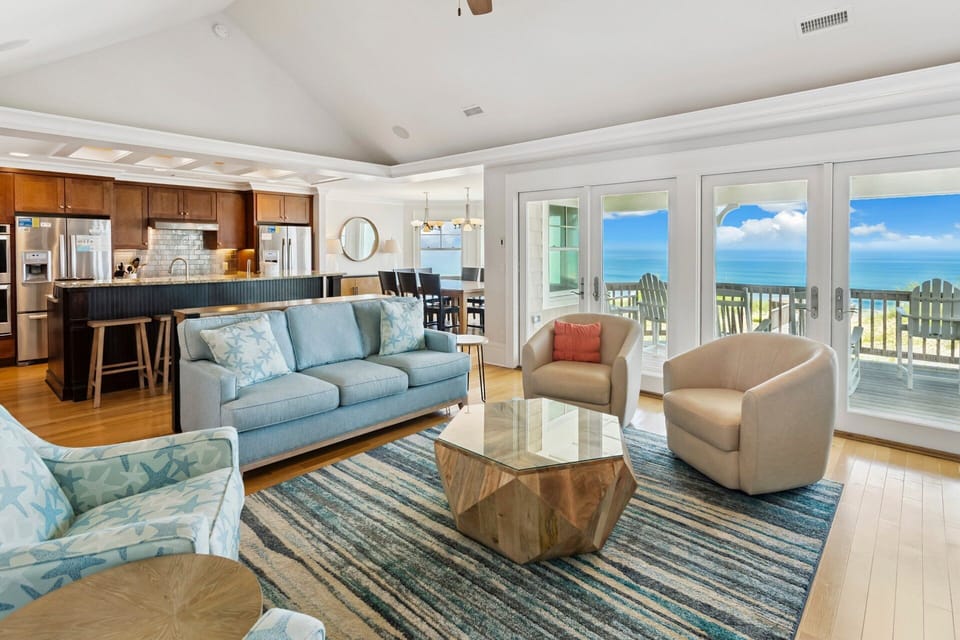 The top-level living area showcases breathtaking ocean views and updated furnishings.