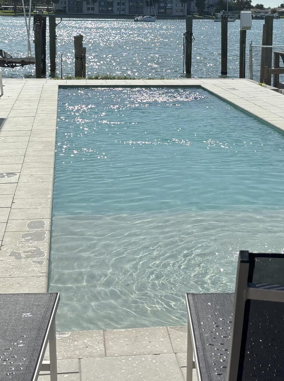 Watch the boats go by while relaxing at the lovely pool.