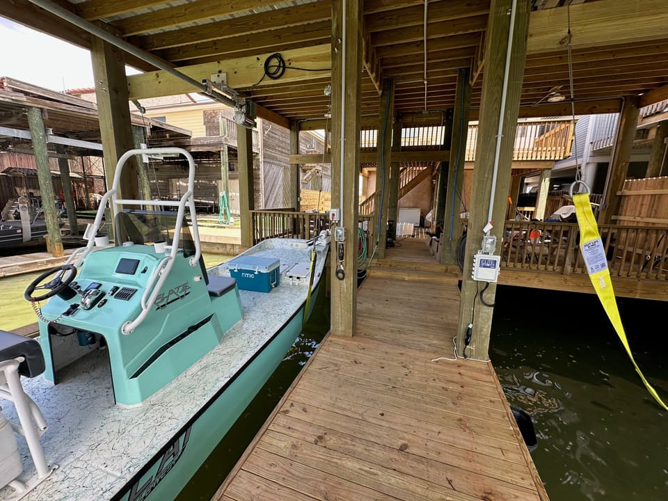 View from canal of Boat Slip note Slip on the NORTH SIDE WHERE THIS BOAT IS SHOWN LEFT SIDE LOOKING FROM WATER is for the Burnett House Up unit