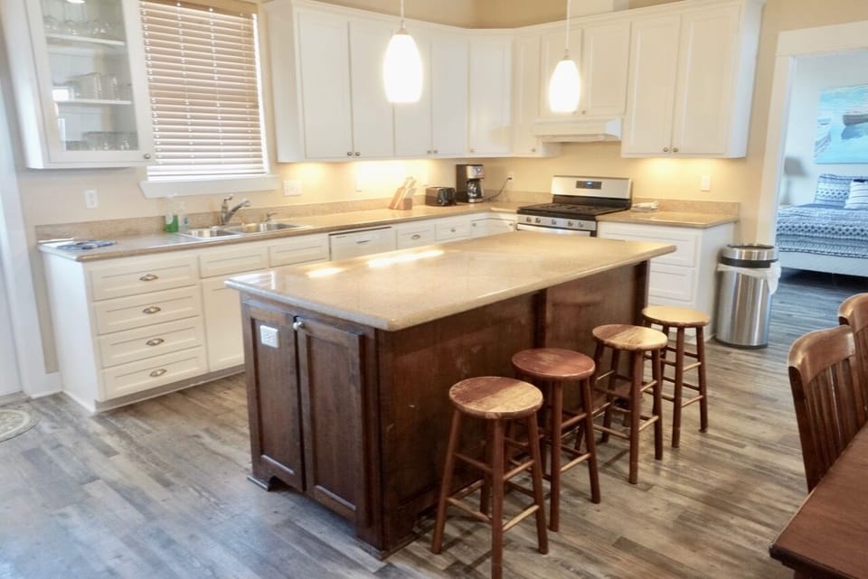 Oversized island and plenty of lighted counter space