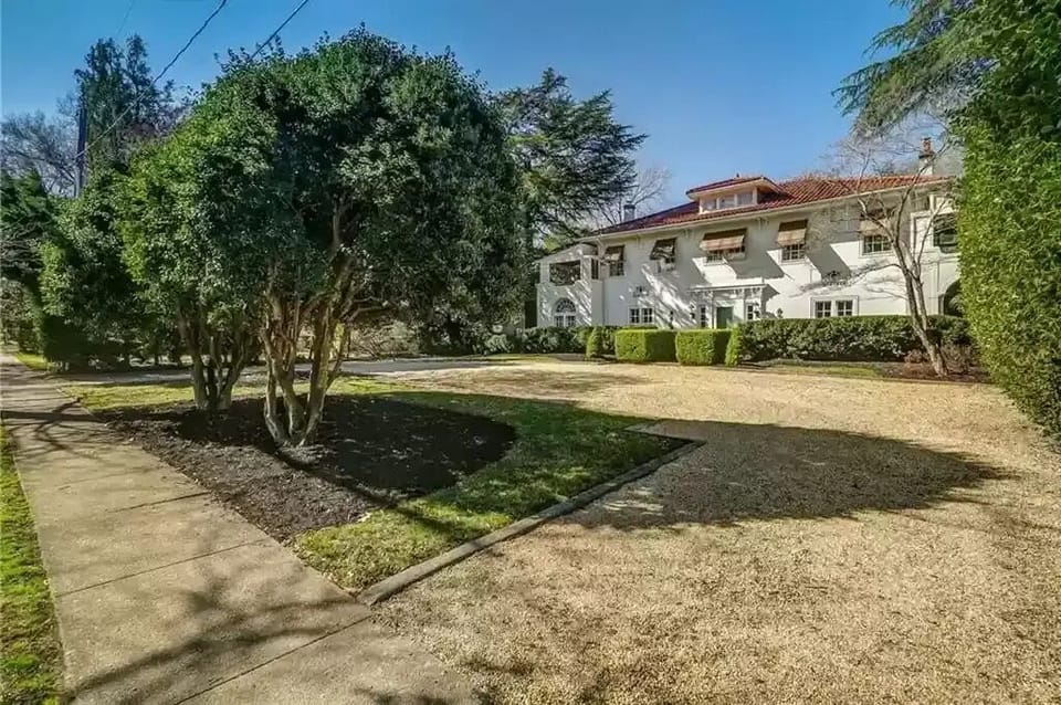 Private off-street parking and a low sidewalk to the welcoming front door.