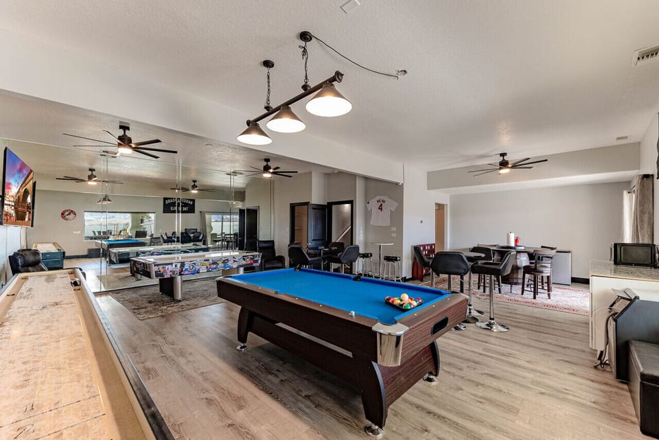 Entertainment room with pool table and lounge.