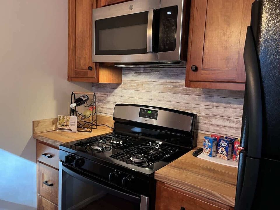 Gas range, microwave and full size refrigerator