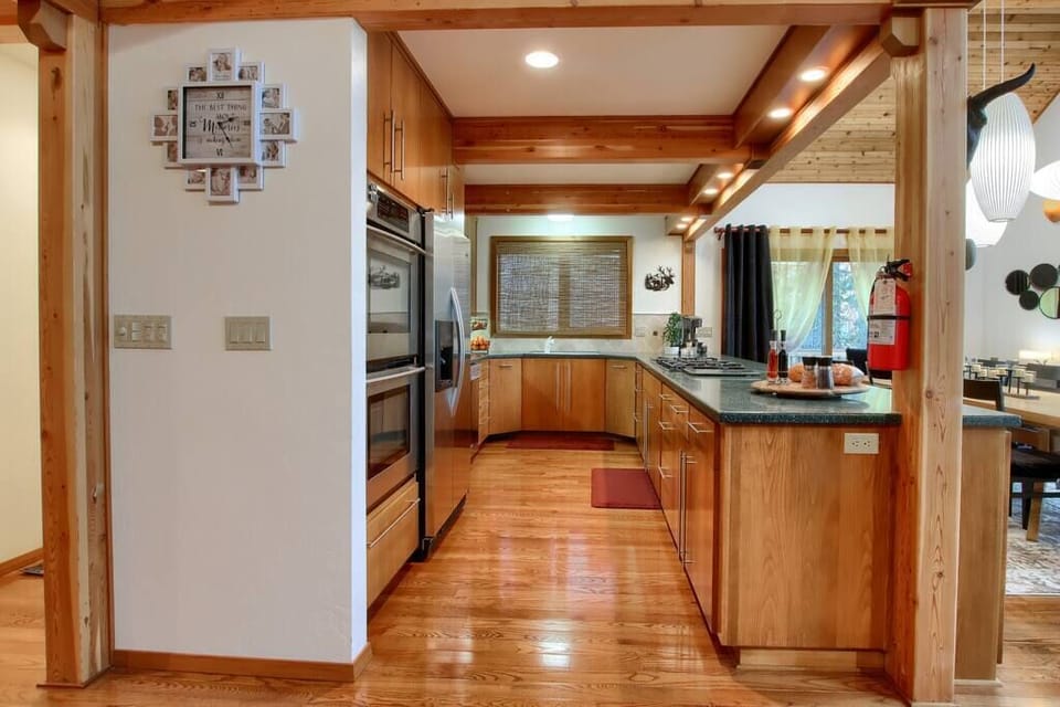 Chef’s kitchen with ample counter space and double ovens.
