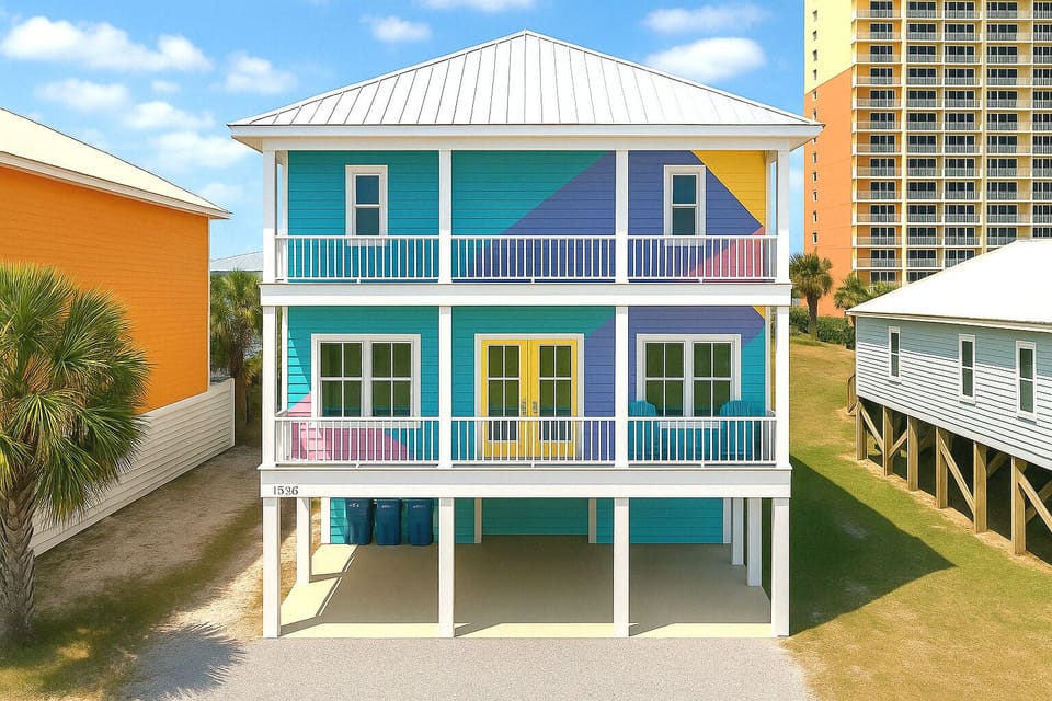 Bold pastel beach house on stilts with double balconies near the shore!