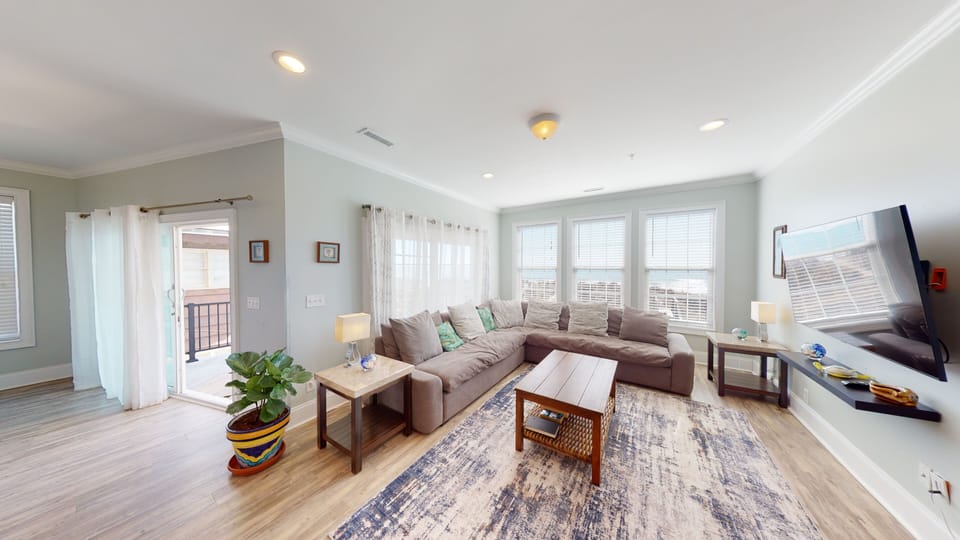Spacious and sunlit, perfect for family lounging after a day at the beach.