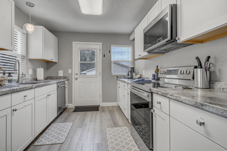 Gorgeous galley kitchen stocked with all your cooking needs!
