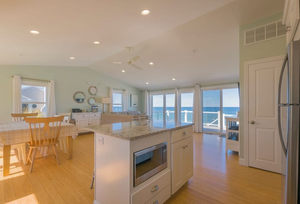 Kitchen island with open concept of dining room and Livingroom.