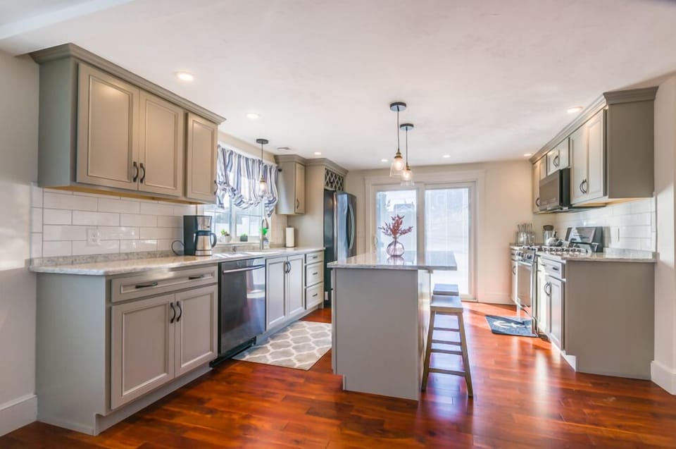 Large updated Kitchen with appliances and island that seats two guests.
