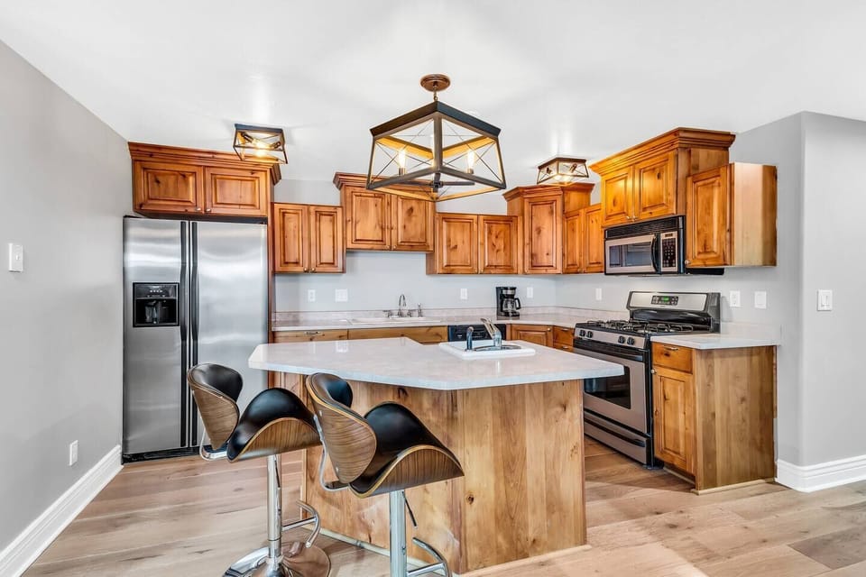 Warm wood kitchen with inviting bar seating