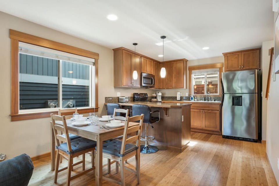 The kitchen bar is the central gathering point of the living area.