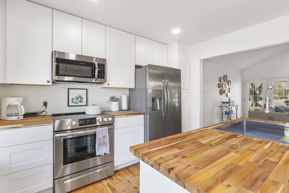 The kitchen is stocked with stainless steel appliances