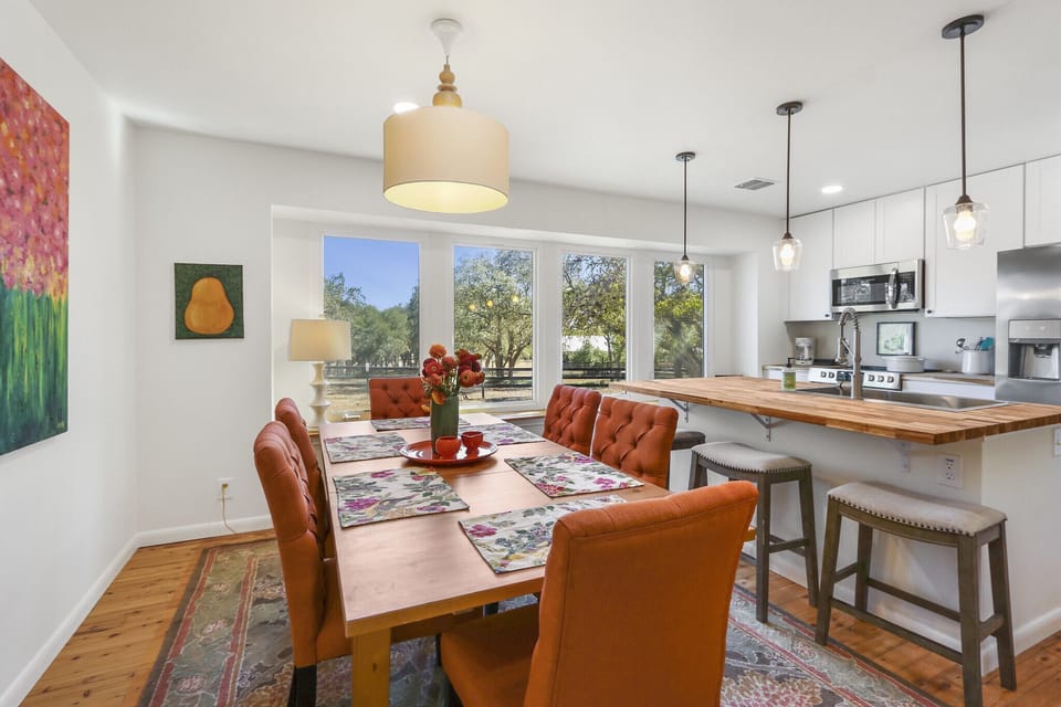 Floor to ceiling windows light up the dining and kitchen spaces