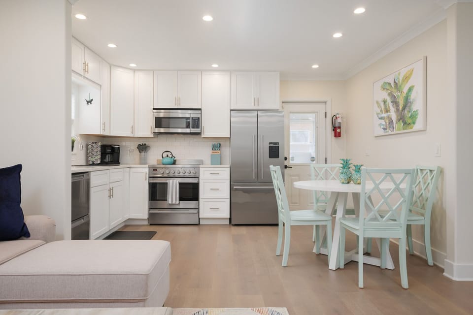 The kitchen door leads to the backyard space and laundry room.