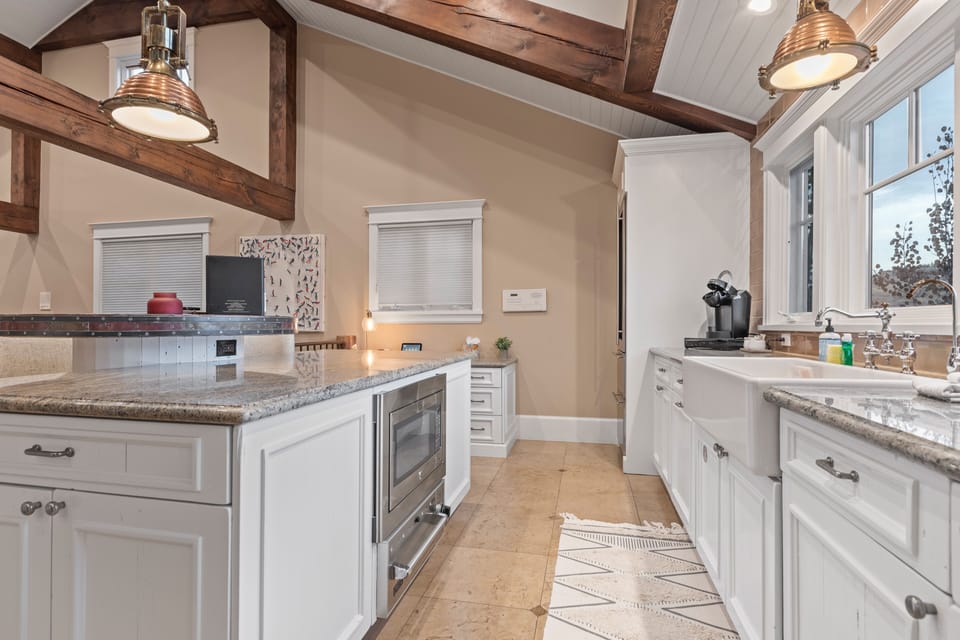 Welcome to mountain luxury! This beautifully updated home features an open-concept kitchen/living area with exposed beams, perfect for entertaining or relaxing after a day exploring Park City.