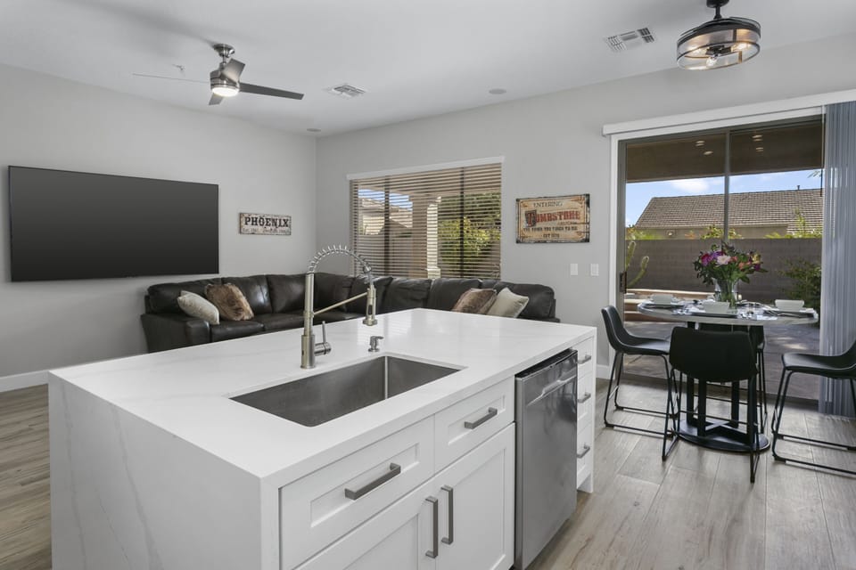 Gorgeous center island with quartz waterfall on both sides
