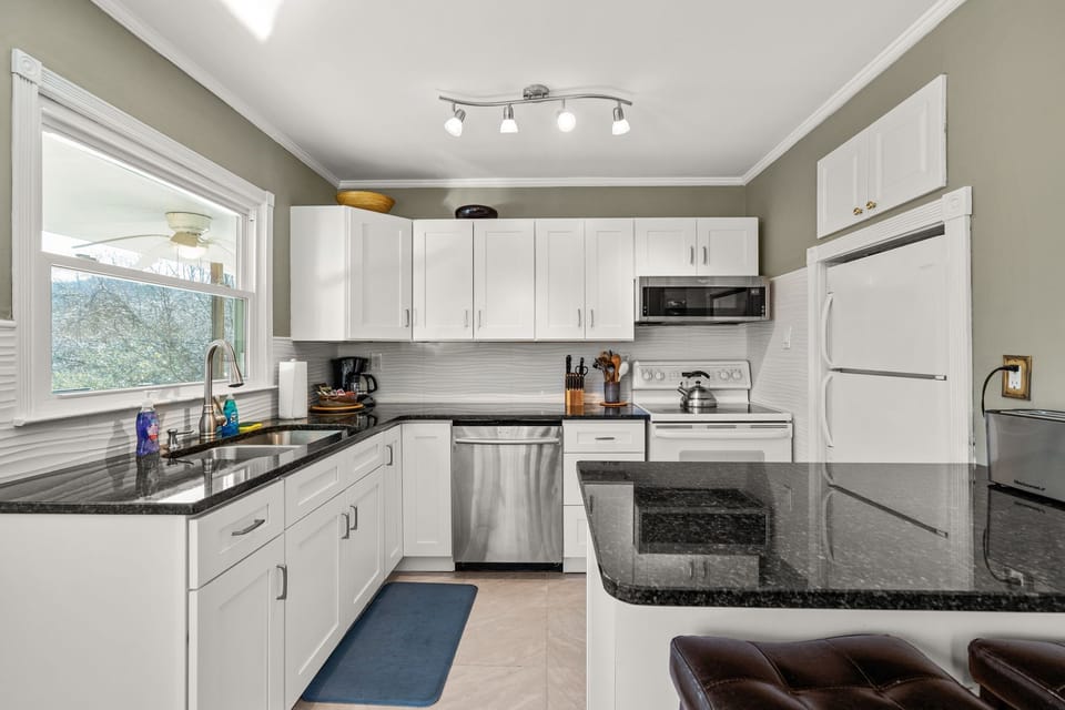 Kitchen area  fully equipt with bar area seating for 2