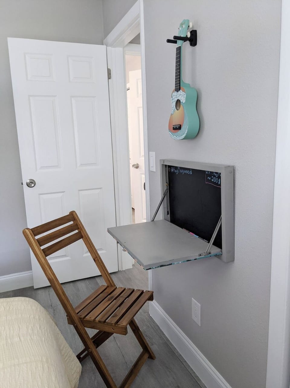 A dropdown desk for when you need to get work done, and a uke for other times.