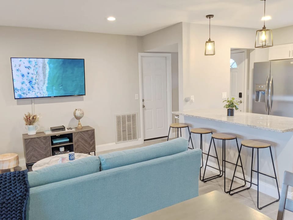 The kitchen opens up into the living and dining room area.