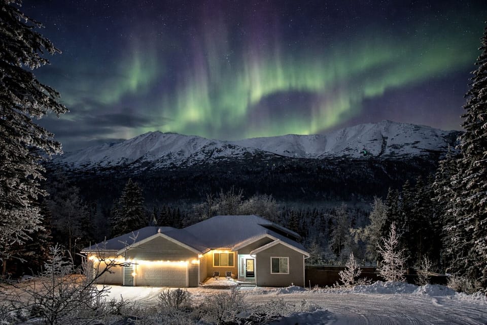 On strong winter aurora nights, skies like this are sometimes visible in the area, depending on weather and solar activity.
