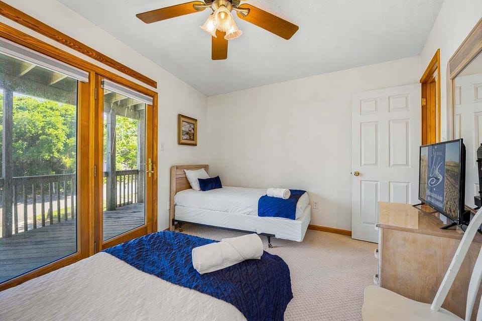 Mid-Level Bedroom with 2 Twin Beds and Deck Access