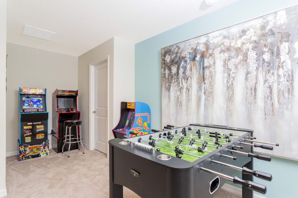 Loft area games. Shown is foosball and 2 arcades.