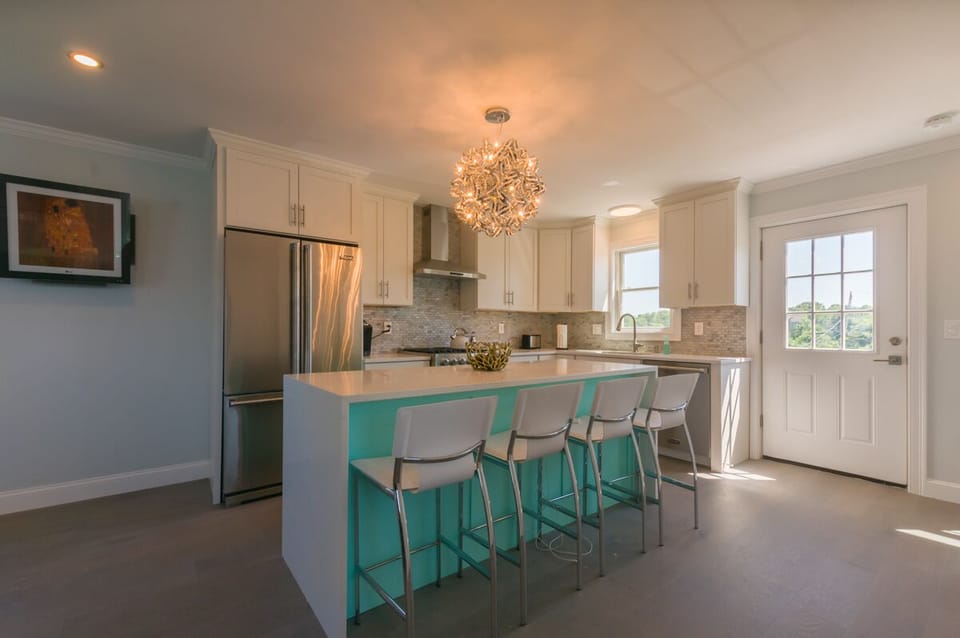 Fully updated kitchen with stainless steal appliances, and island that that seats four guests.