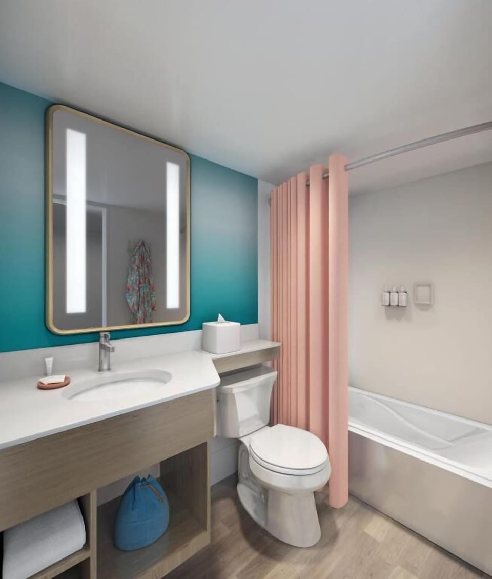 Refresh in a spotless bath with glowing mirror lighting.