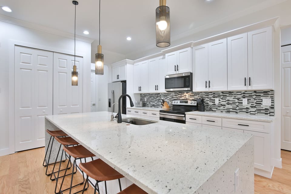 open concept kitchen counter with bar to seat 5