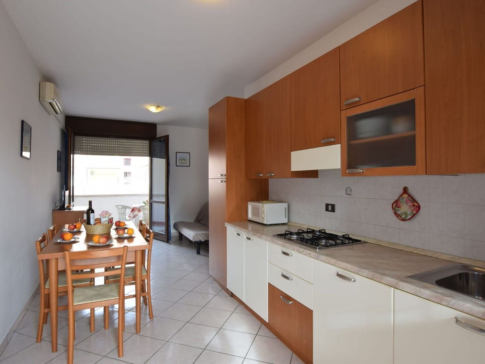 Cabinetry, Furniture, Countertop, Kitchen, Wood, Sink, Building, Kitchen Appliance, Kitchen Stove, Table