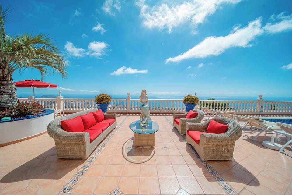 Unwind on the terrace with Atlantic and Adeje views beside the mermaid