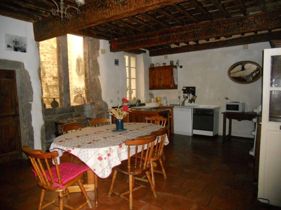 Maison d'Estella kitchen dining opens into courtyards