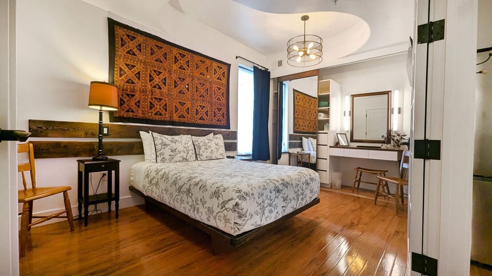 The vanity in this Suite is accessThere is a 5-foot turning space between the bed and vanity-closet. The bed platform has a 9` toe-kick adding unseen space in the room.