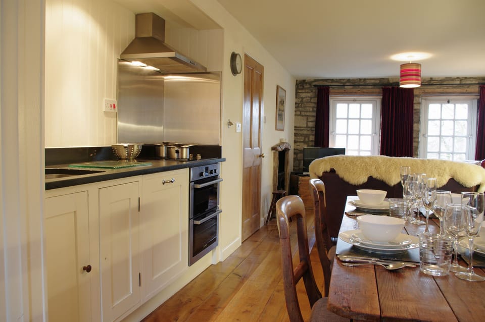 Dining and kitchen area at The Old Wheelhouse, The Mill in West Burton, Wensleydale in the Yorkshire Dales