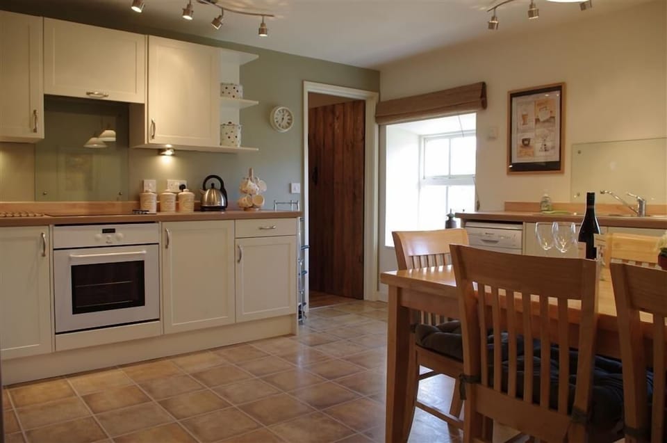 Kitchen with dining area at Hill Top Cottage in Walden dale near West Burton in the Yorkshire Dales