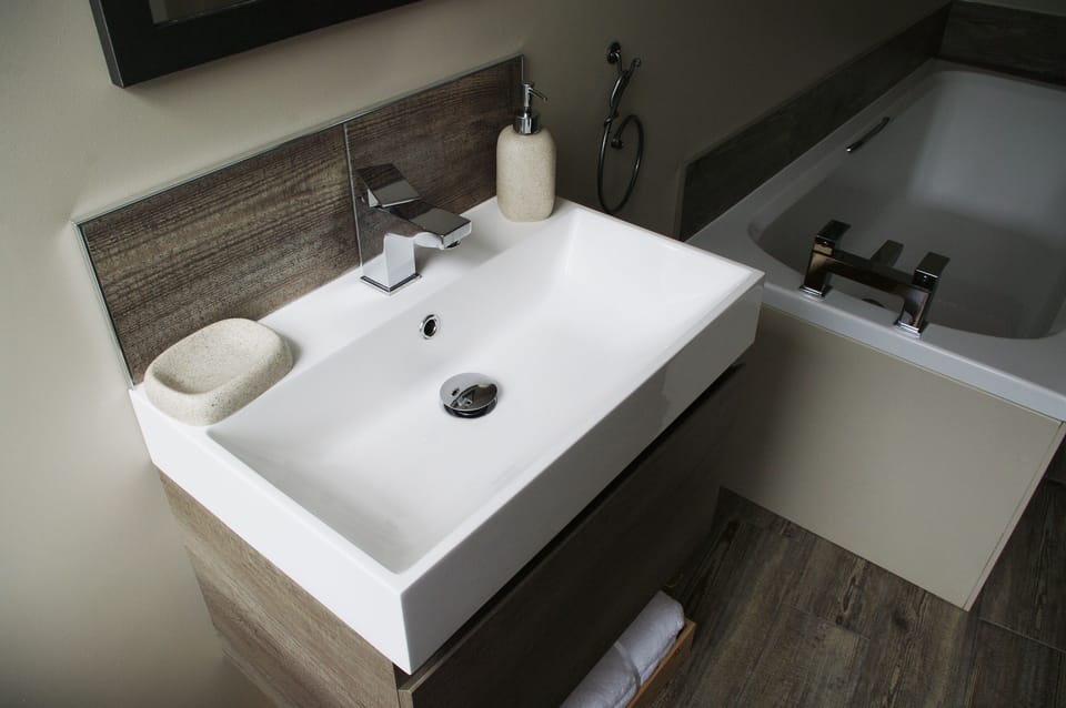 Downstairs bathroom with separate shower in Forge Cottage in Masham