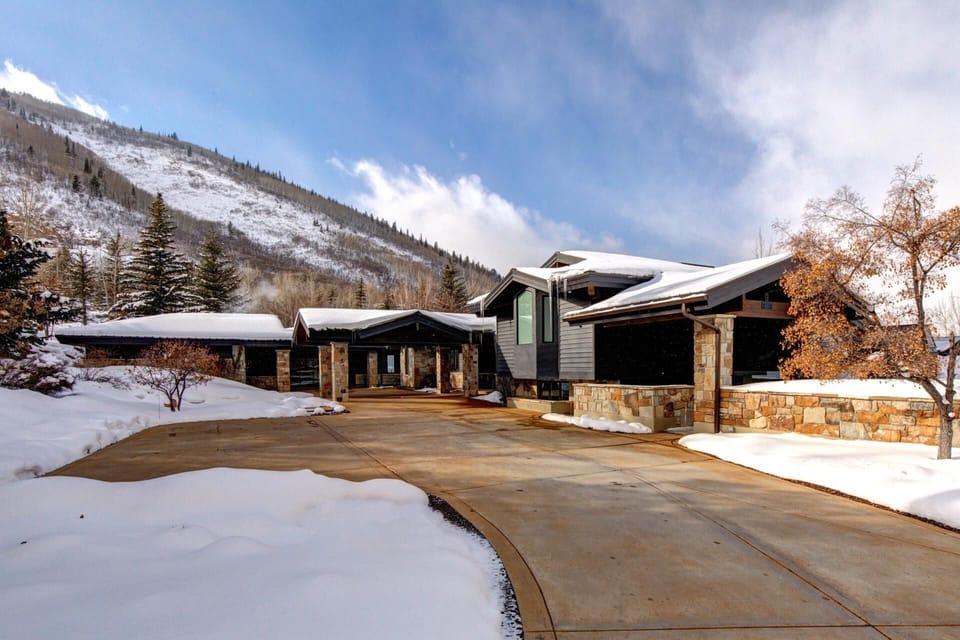 A sweeping drive leads to your private mountain retreat with grand entrance and multiple garages.