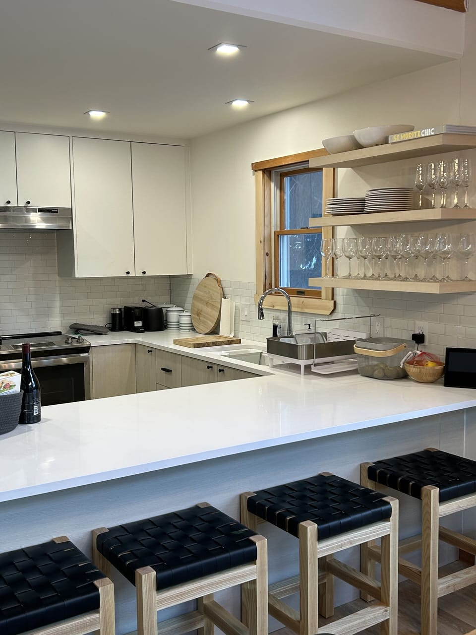 Kitchen with counter for breakfast or apres ski. custom stools