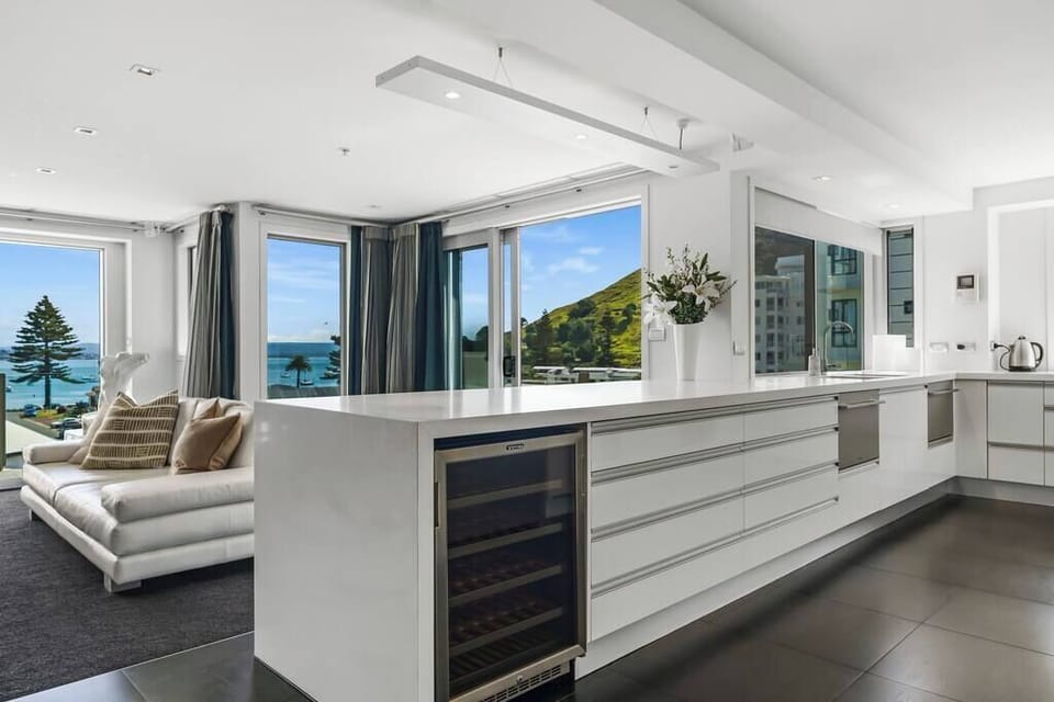 Gourmet Entertainers kitchen with two ovens, two dishwashers, large double door fridge and wine fridge 