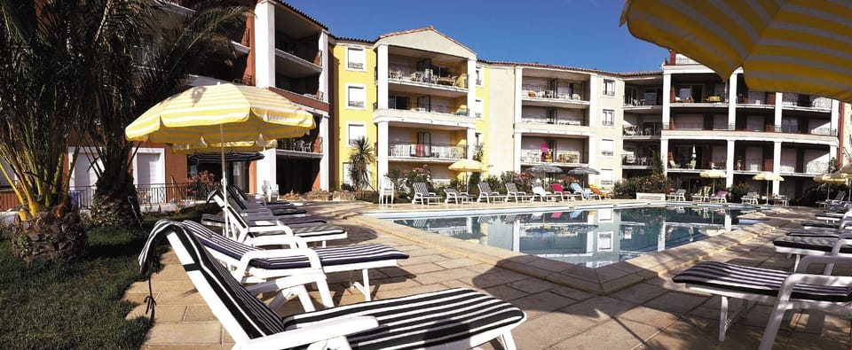 Enjoy lounging by the shared outdoor pool.