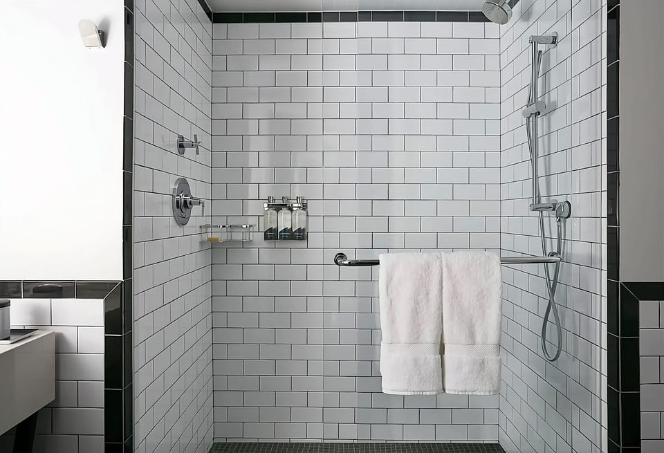 Rinse off in a sleek walk-in shower with rainfall head.