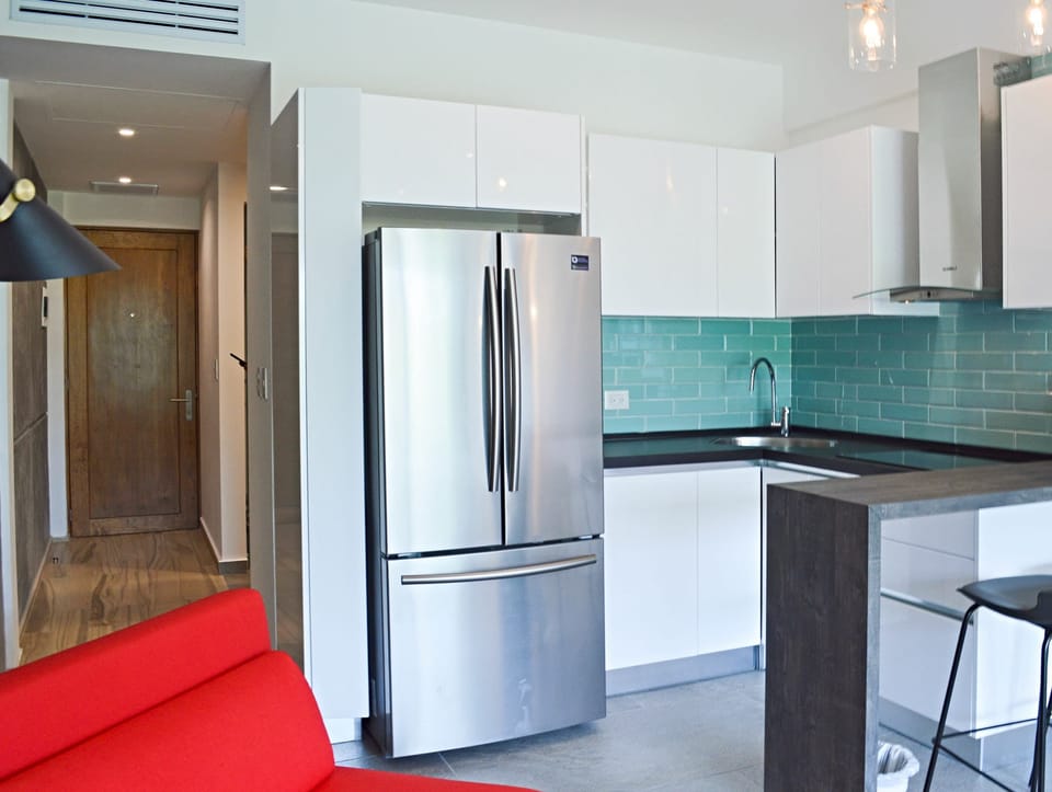An equipped kitchen to make basic meals at home