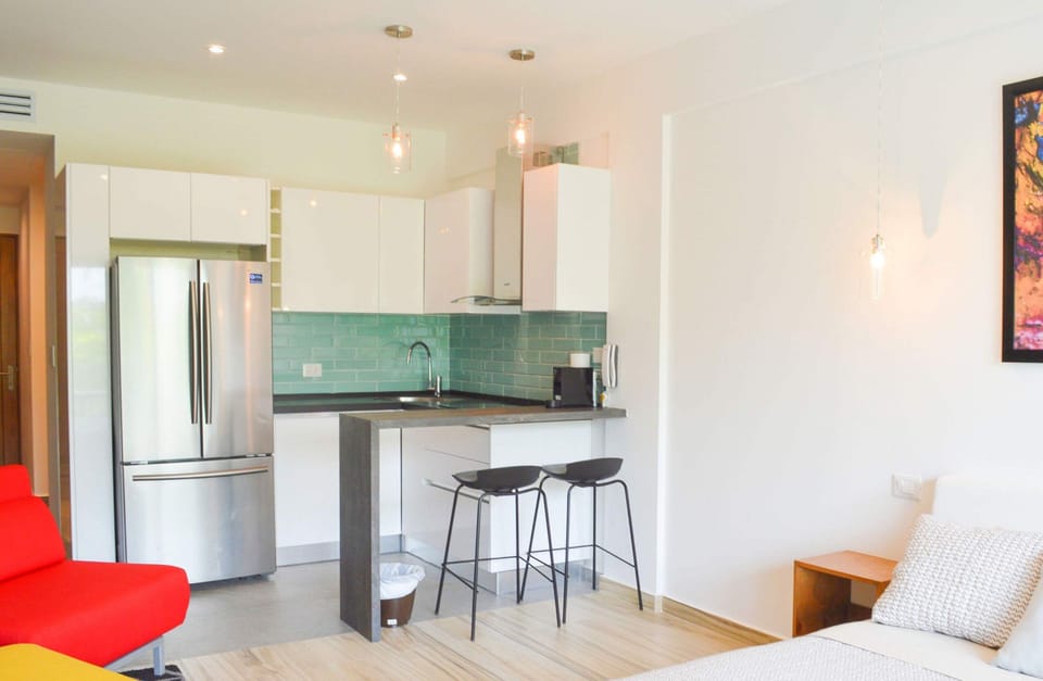 Two bar stools at the kitchen breakfast bar to eat meals at home