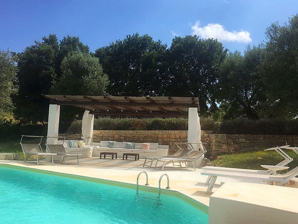 Sun loungers and comfortable couches for enjoying lazy days by the pool