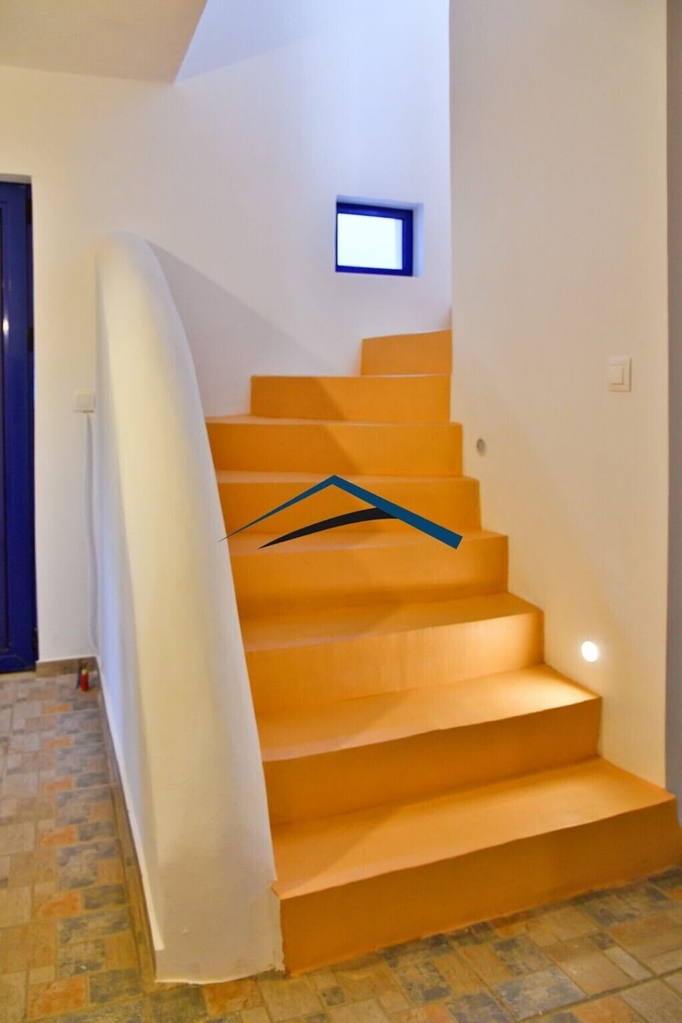 Stairs leading to the lower ground floor with a second entrance