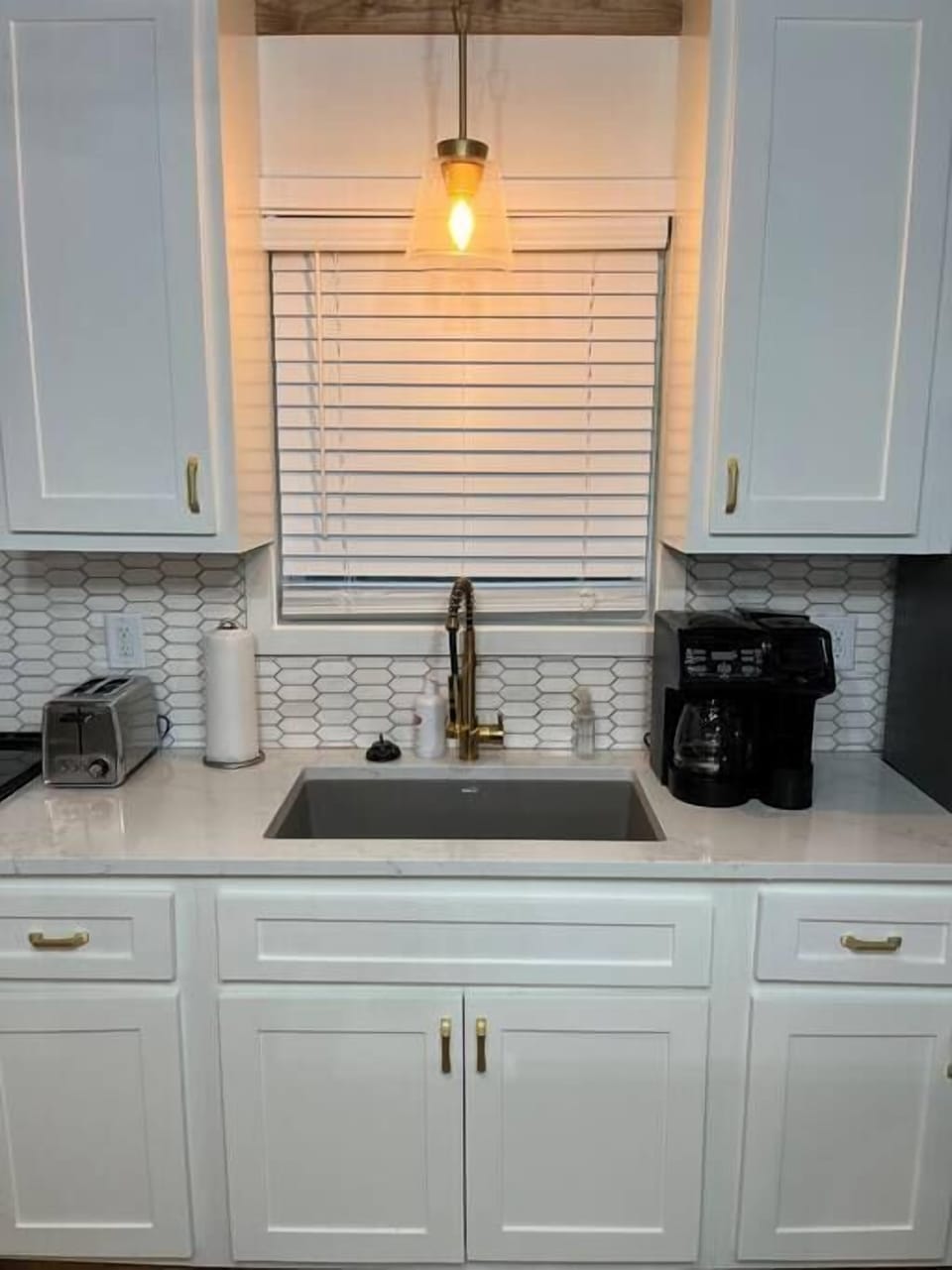 The kitchen has a drip coffee pot combo with K- cup 