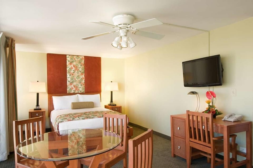 Relax in a bright room with comfy seating and warm island style