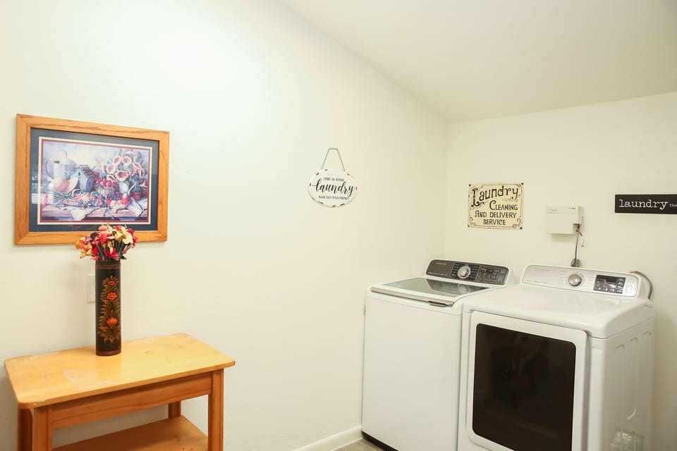 Laundry Room - Full washer and dryer with additional refrigerator.